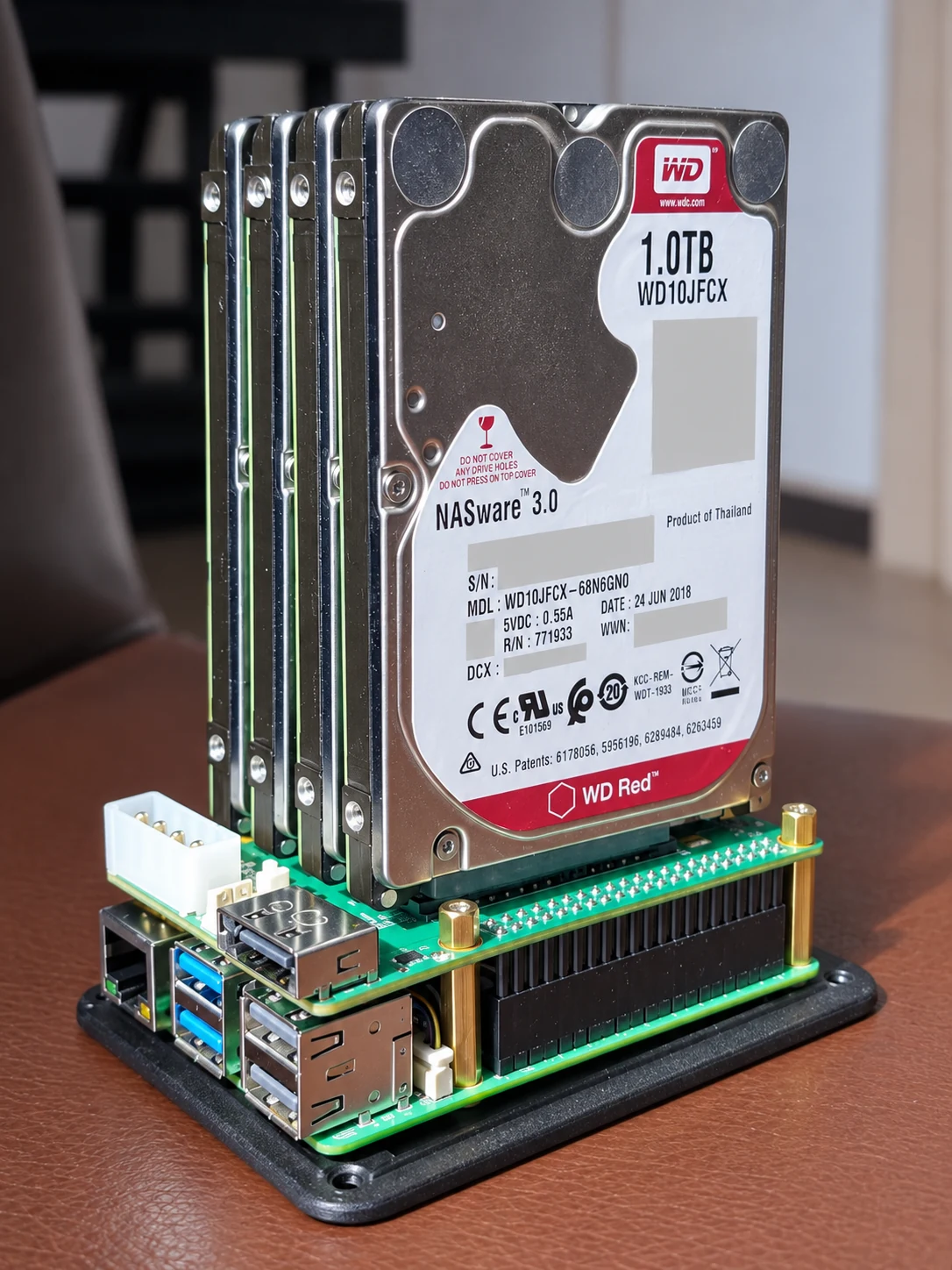 Four upright hard drives on the SATA HAT above the Raspberry Pi, before the enclosure is fitted